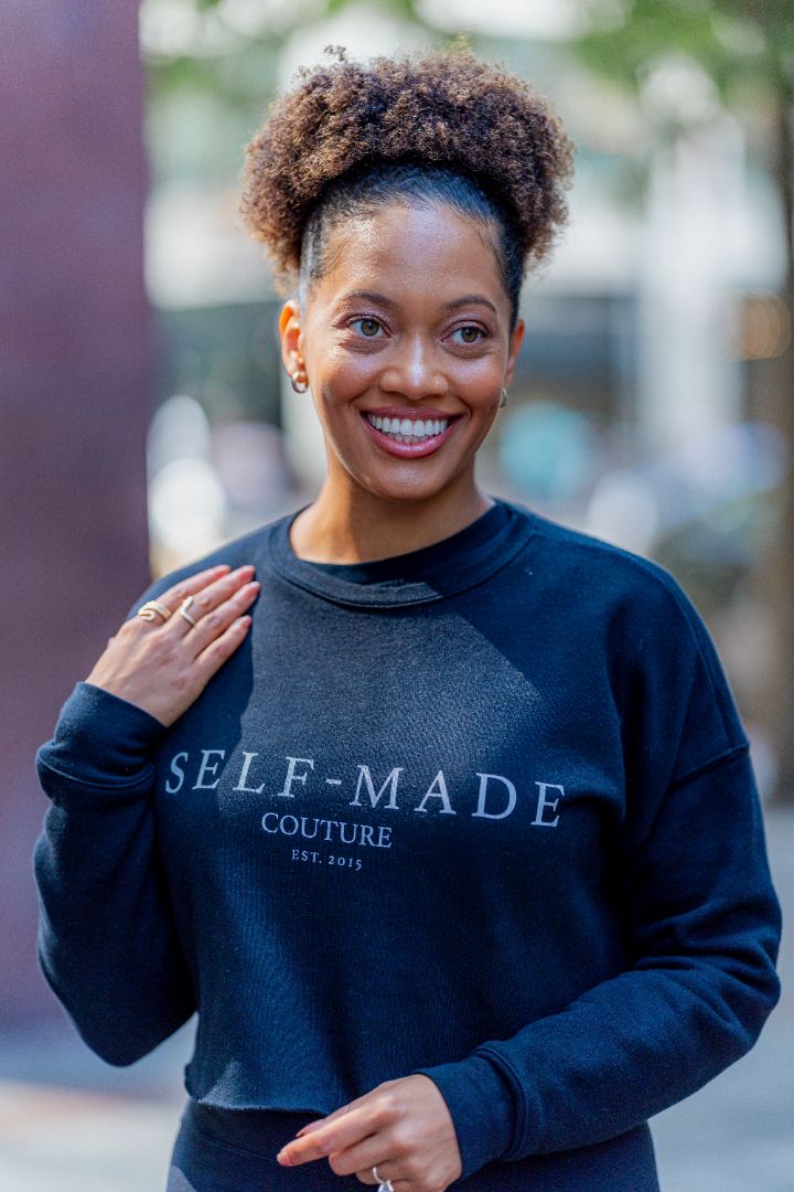 Sydney Chestnut wearing a black Self-Made Couture shirt outdoors