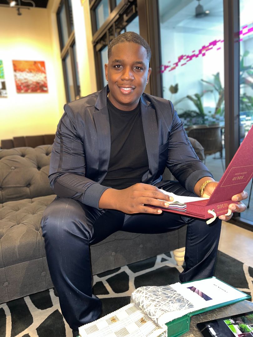 Client reviewing fabric samples in a showroom